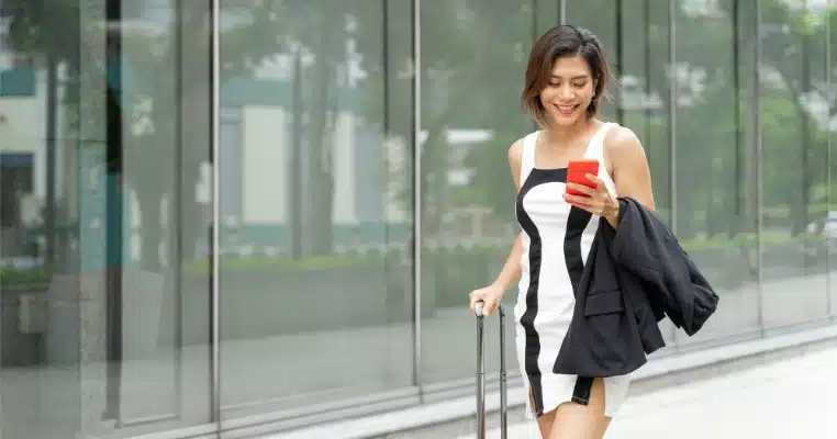 traveler checking her phone