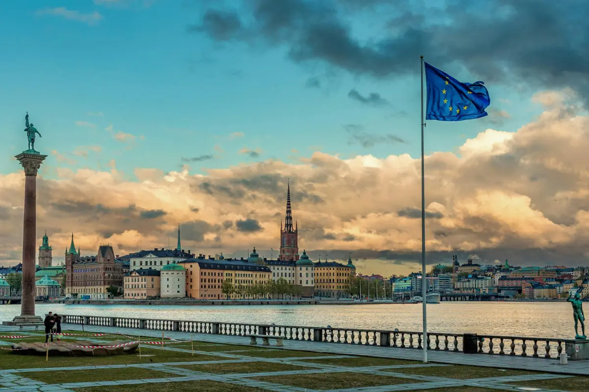 Stockholm waterfront with European Union flag best eSIM for Europe travel across multiple countries