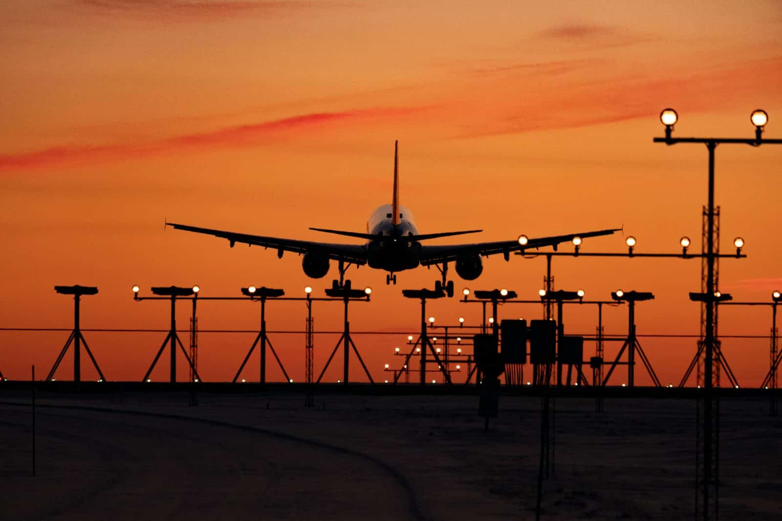 International flight departing Frankfurt Airport at sunset buy your travel SIM card before you board