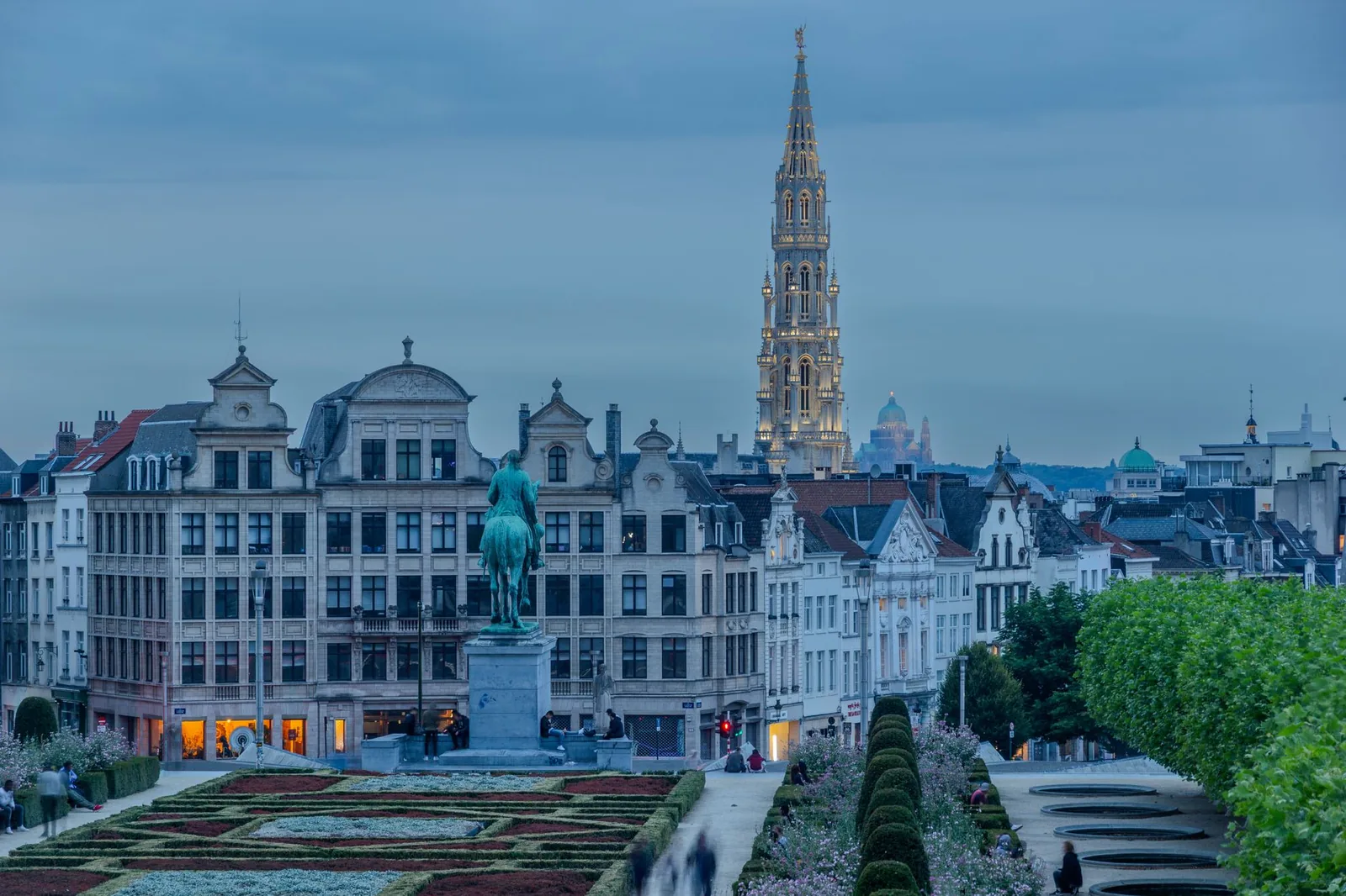 View over the Mont des Arts in Brussels, its geometric gardens and the Town Hall spire in the evening light