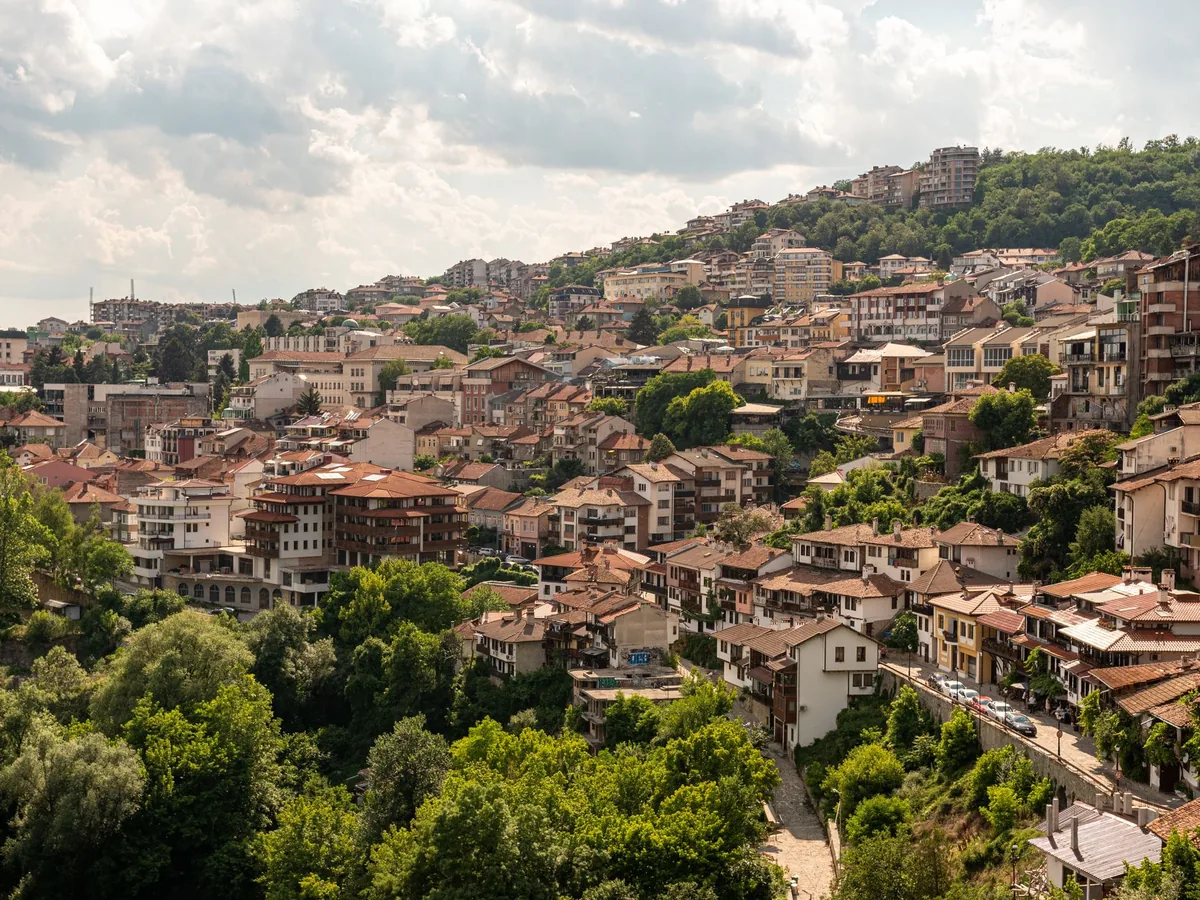 Colourful old town of Veliko Tarnovo, Bulgaria, houses stacked on the hillside above the Yantra river